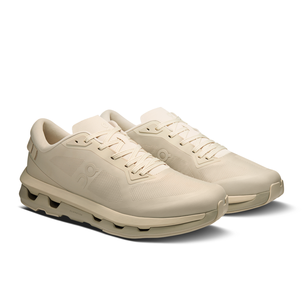 On Cloudzone running shoes in light cream, side view with lace-up upper