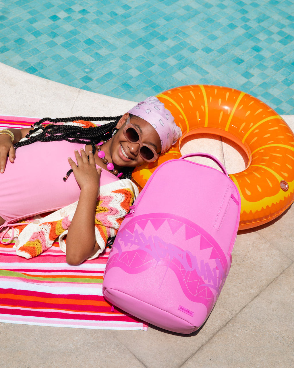 Pink shark-graphic backpack bag with curved silhouette, front wave print, zip pocket