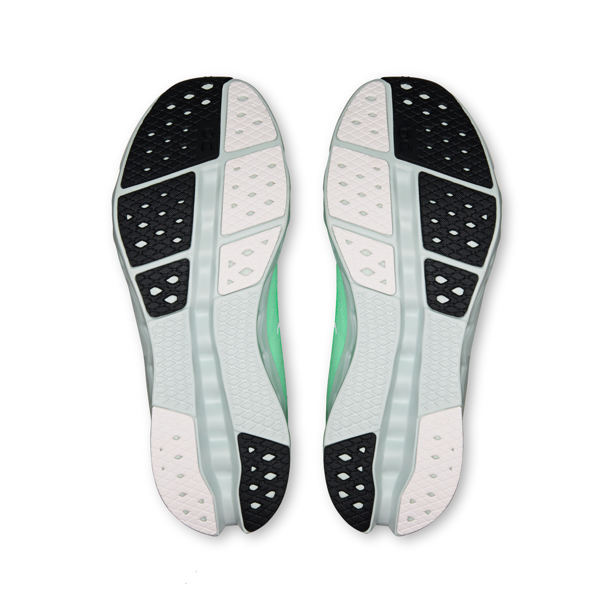 Shoe soles view: green and black tread on white outsole, pair