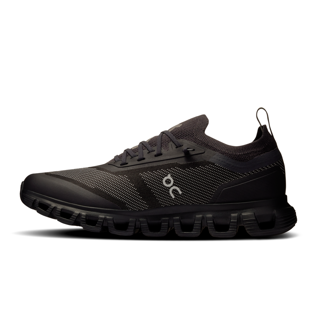 Women\u2019s black running shoes, side profile with lace-up mesh upper and logo