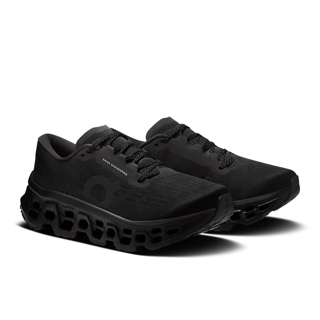 Women's black running shoes, side view, lace-up mesh upper and CloudTec outsole