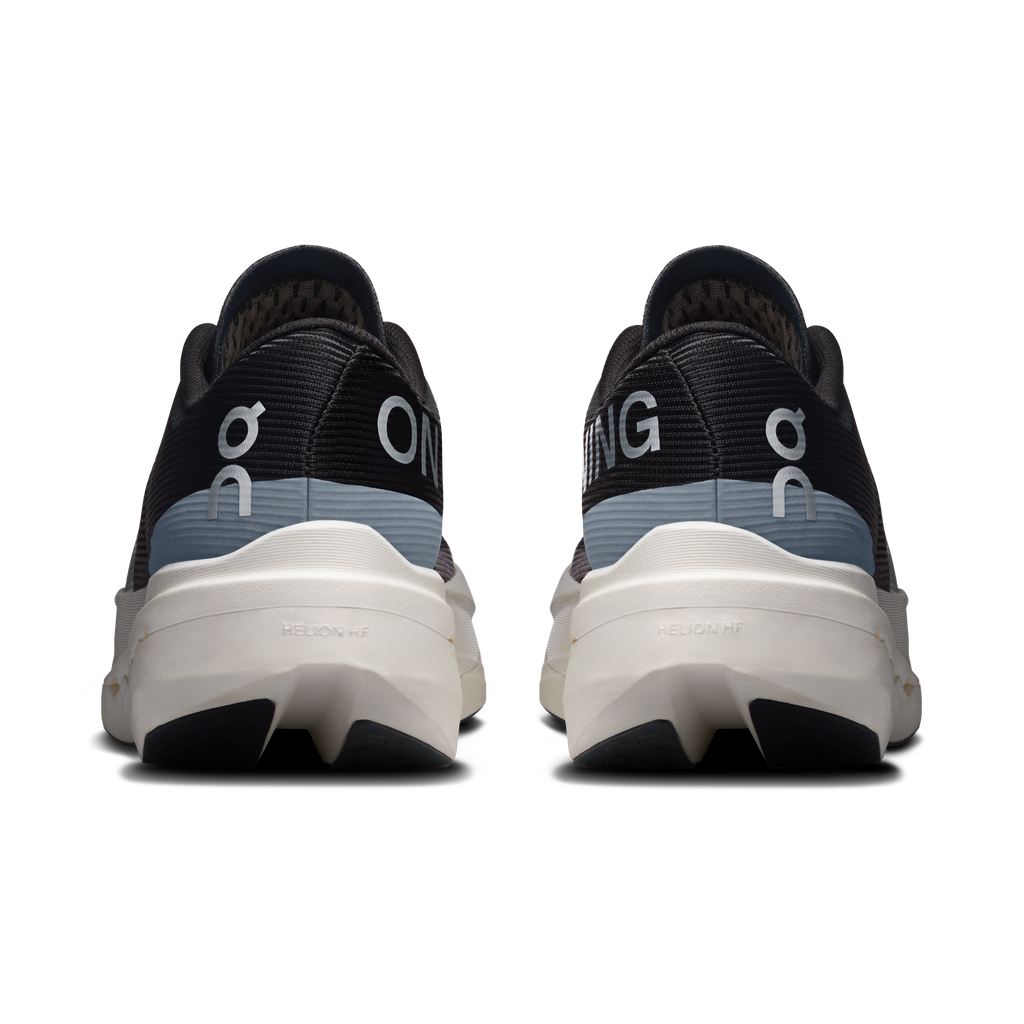On men's running shoes, back view with black heel, blue accent stripe, white midsole