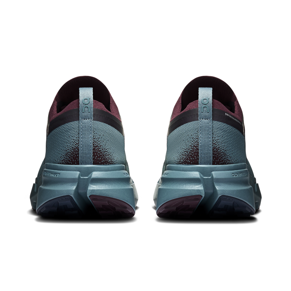 Shoe heels view with maroon collar, speckled blue upper, and light-blue outsole tread