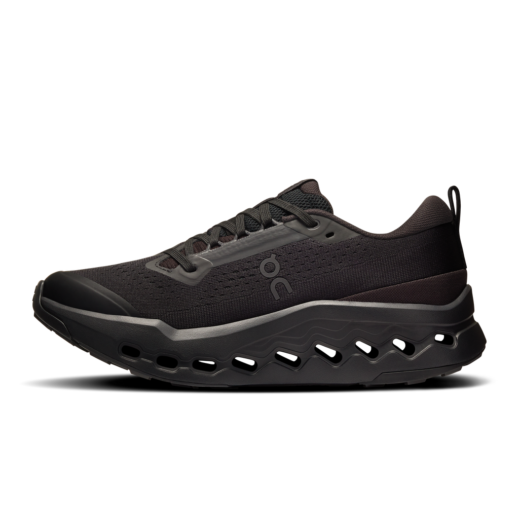 Women’s black trail running shoes, front-side view with lace-up upper and rocker sole