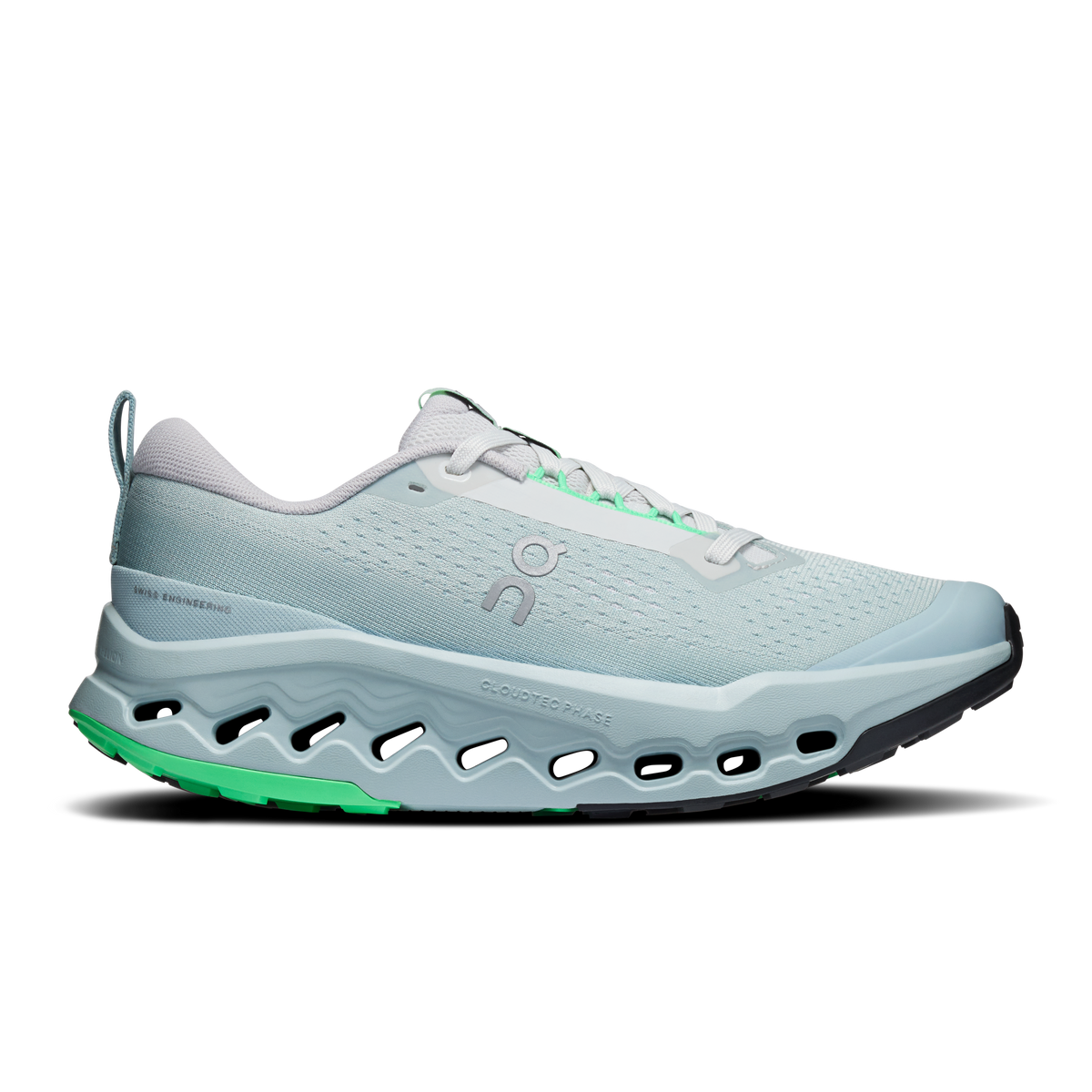On women's trail running shoes, light blue mesh upper, white laces, green accents