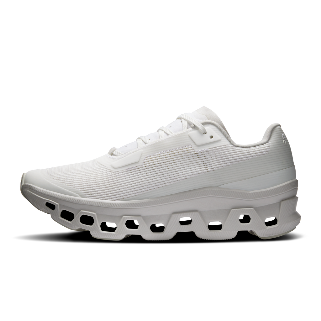 Women's white running shoes, side profile with thick cushioned CloudTec sole