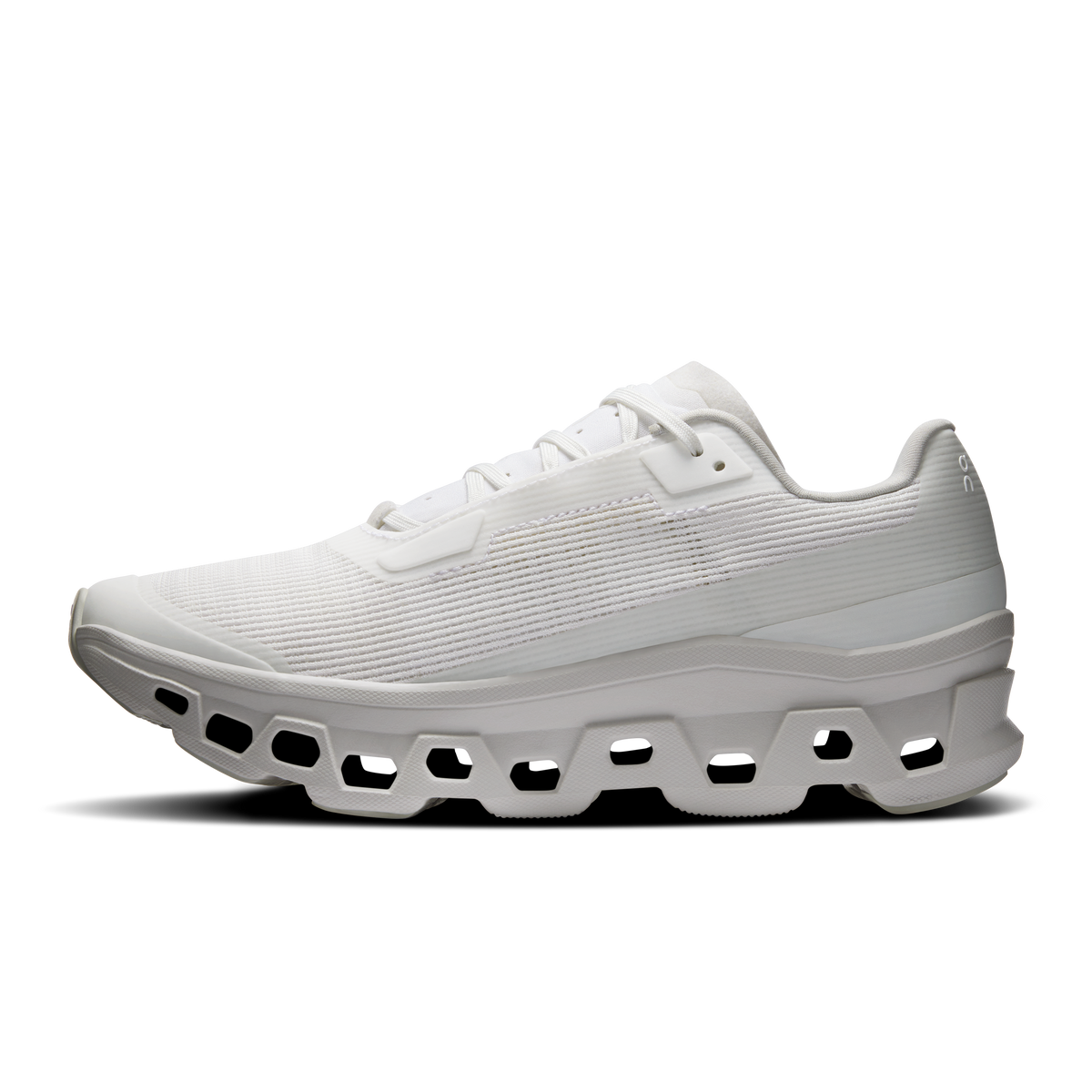 Women's white running shoes, side profile with thick cushioned CloudTec sole