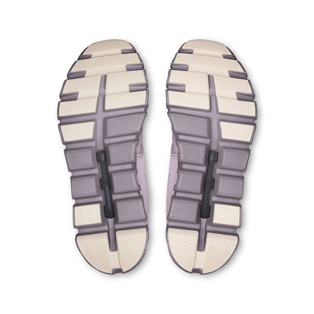 Outsoles of mauve running shoes with tread pattern and grip pods