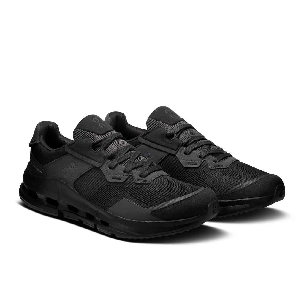 Men's black running shoes with lace-up design, padded collar, and rubber tread