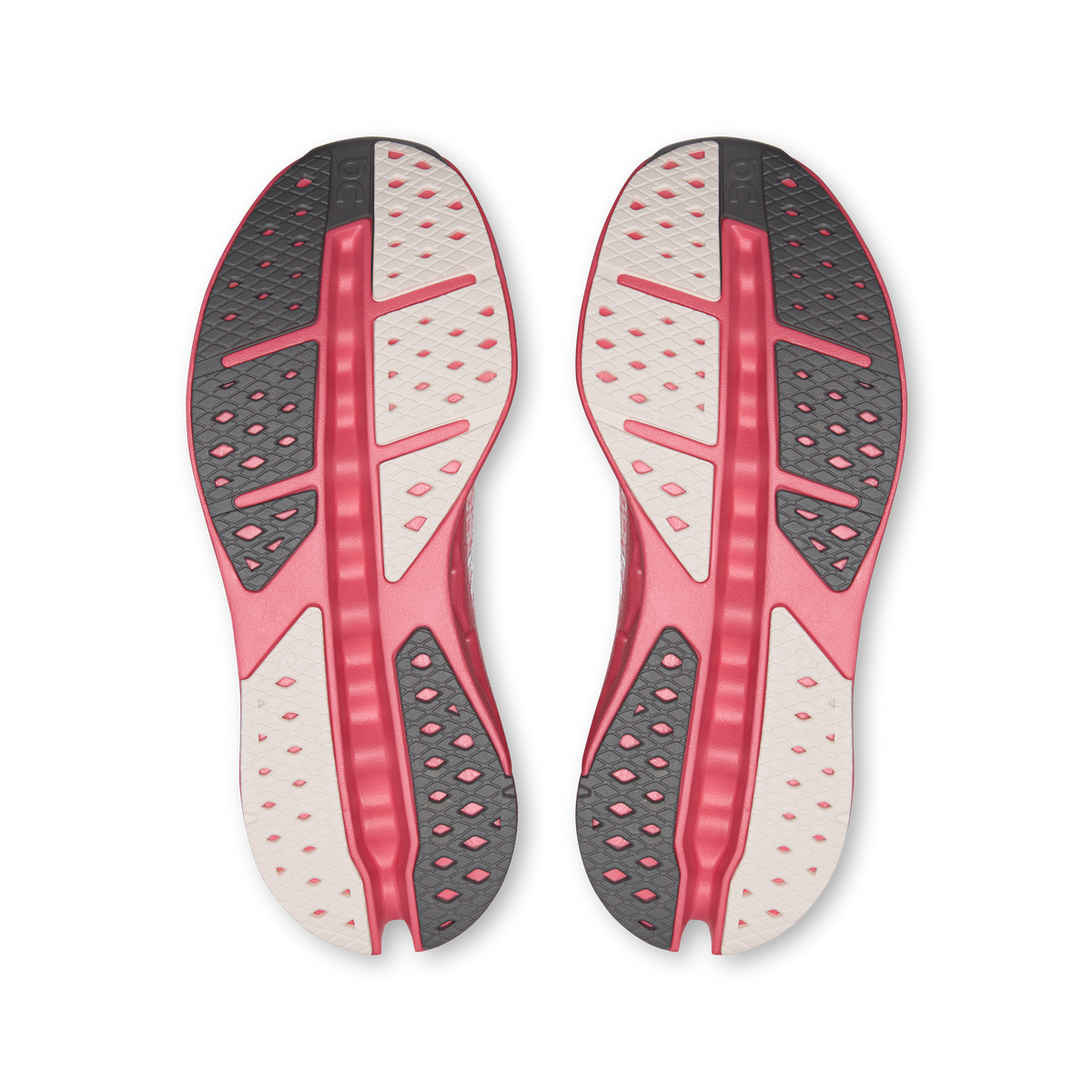 Women's running shoes, underside view with textured pink-and-white traction pods