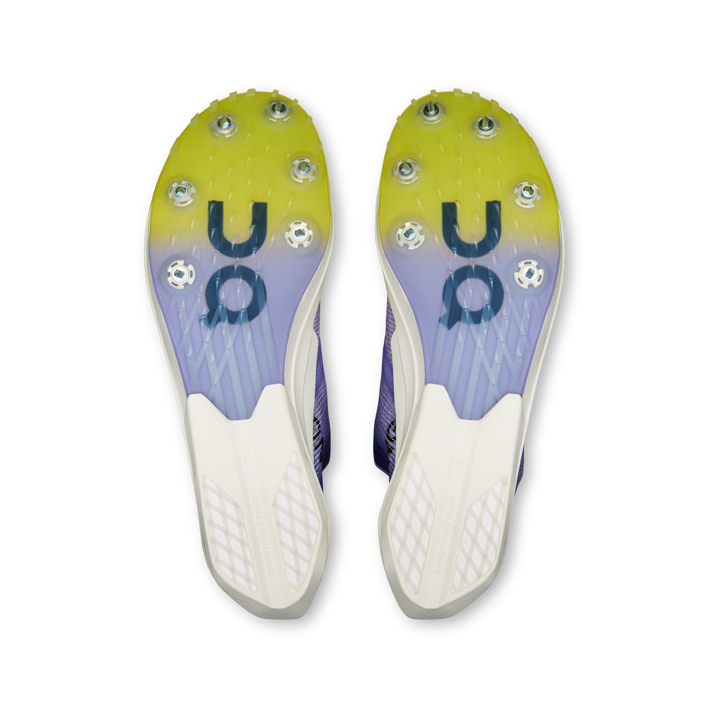 Men's running shoe outsoles with lime traction studs, white sole panels