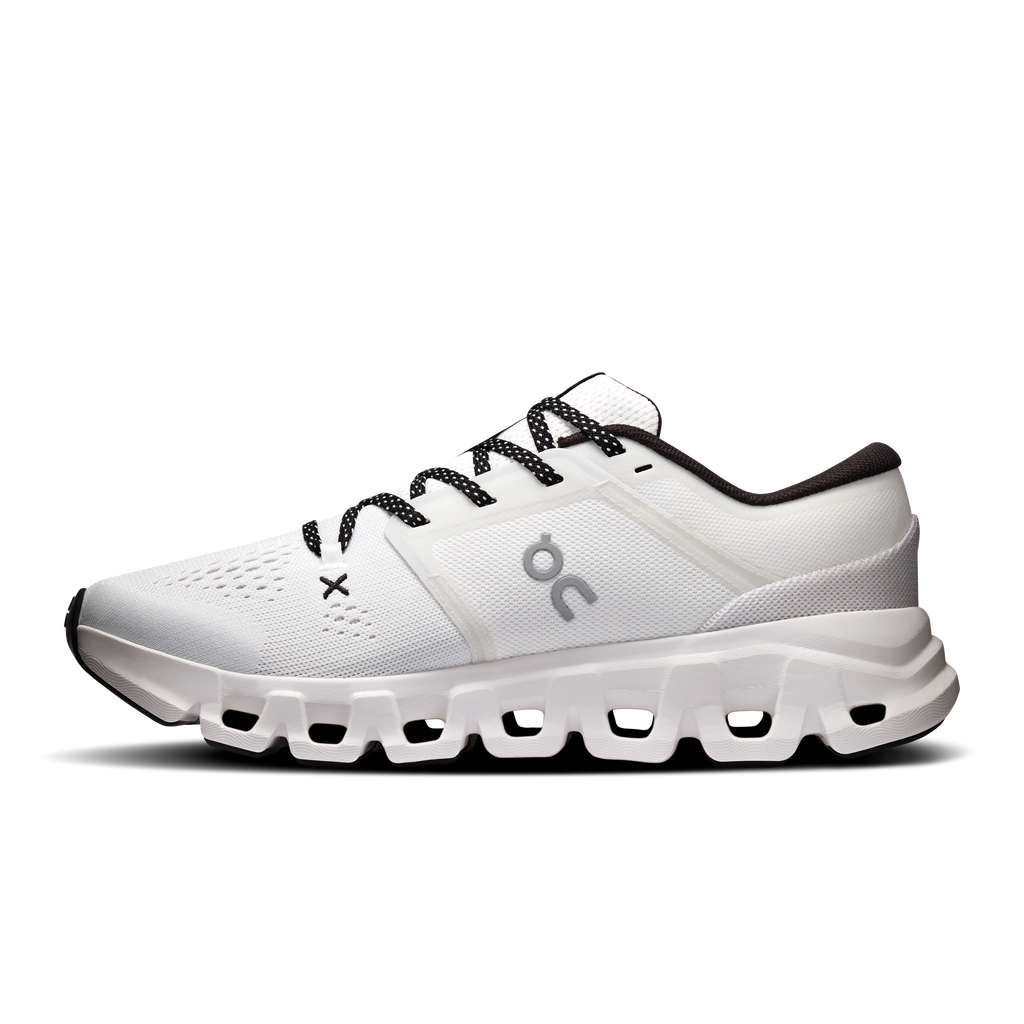 Women's white running shoes with black lace-up and cushioned sole