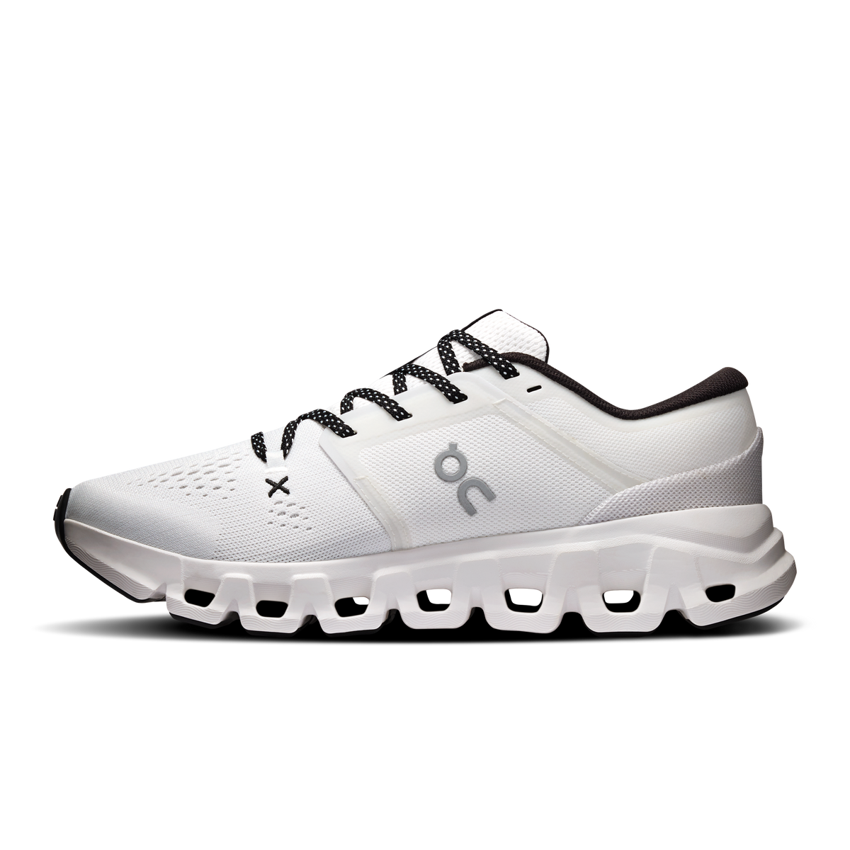 Women's white running shoes with black lace-up and cushioned sole