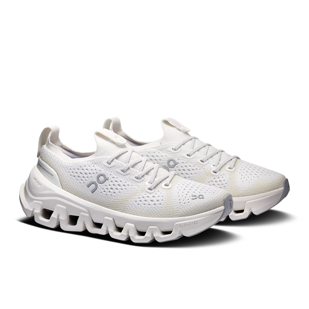 Women's ivory running shoes, side view with laces and On logo on mesh upper