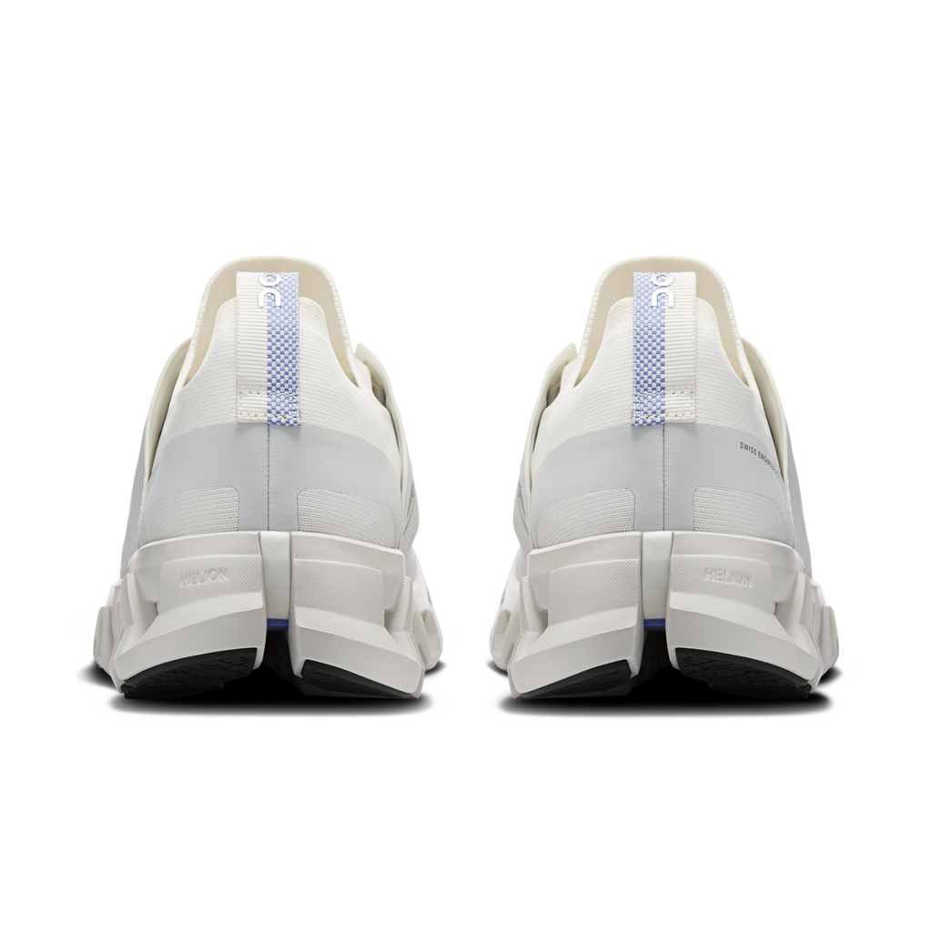 Ivory running shoes rear view with heel padding and blue pull-tab accents