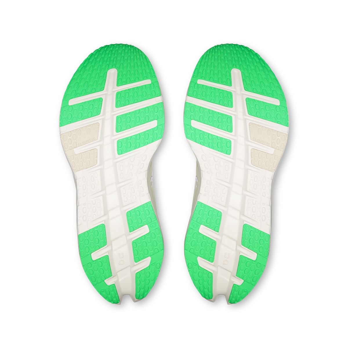 Shoe outsoles pair with textured tread in bright green and white, On logo details