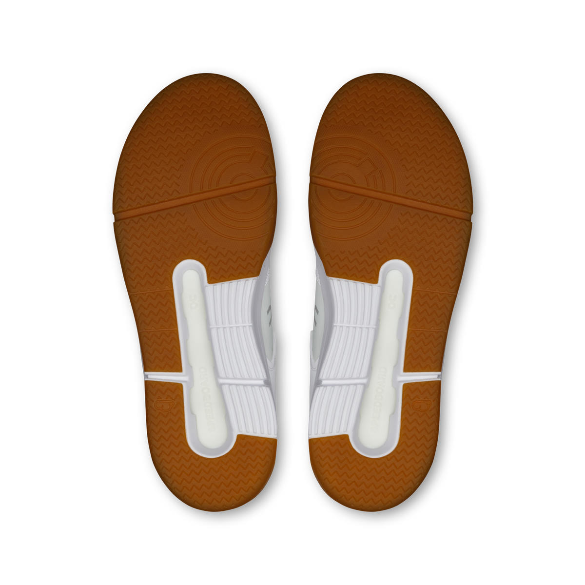 On women's sneaker outsoles in gum brown with tread and white heel pods