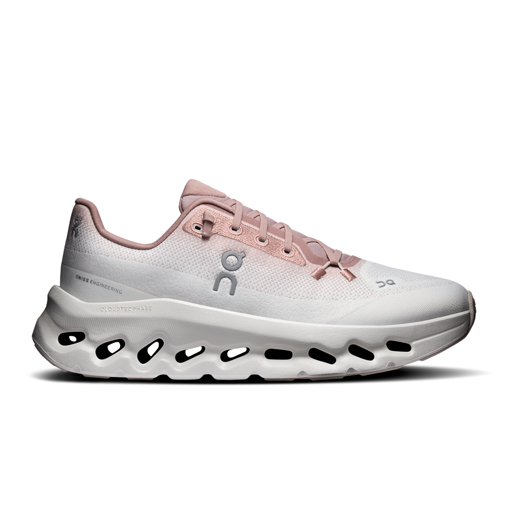 Women’s running shoes in biscuit and ivory with CloudTec-style foam sole