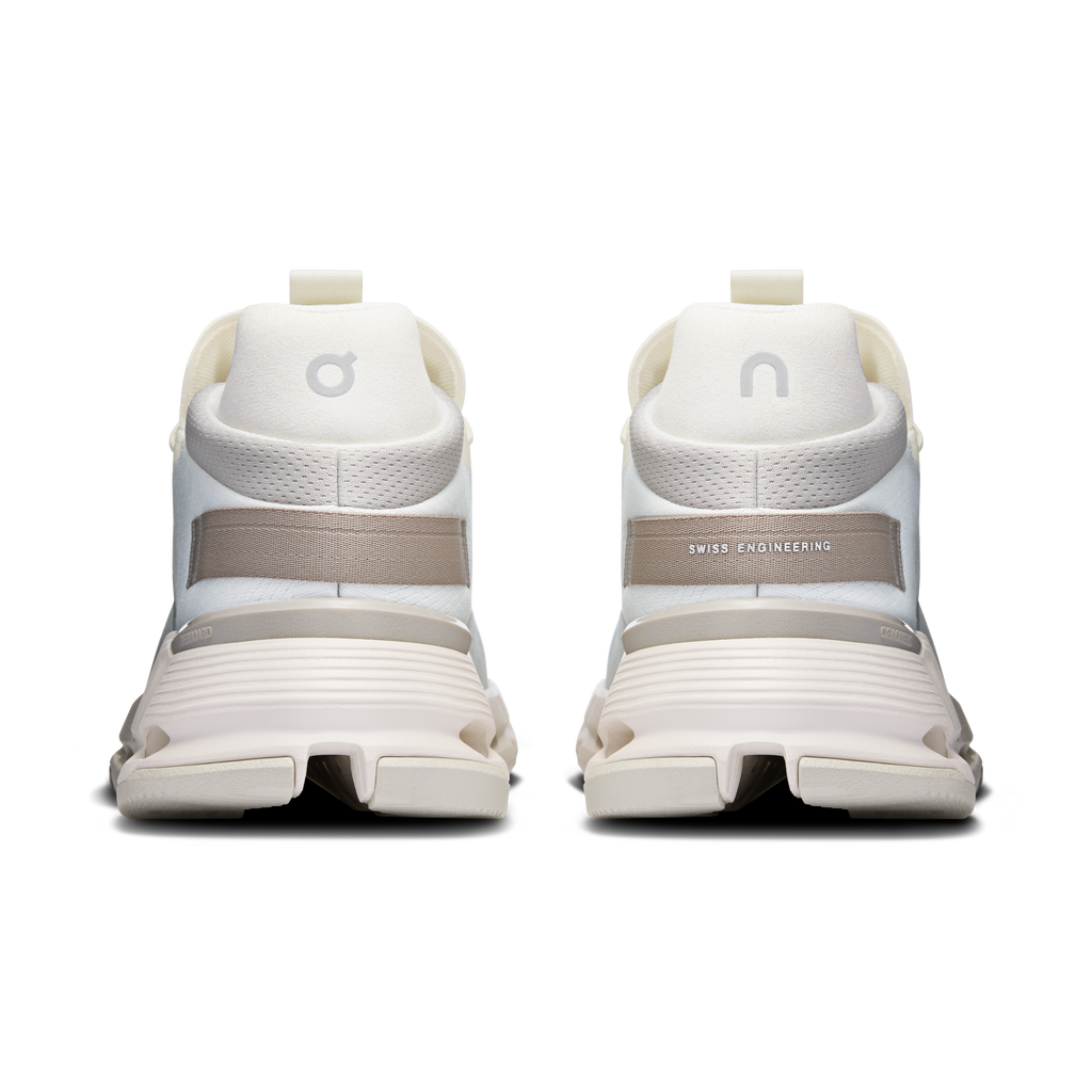 Back view of white running shoes with cushioned heel and Swiss Engineering label