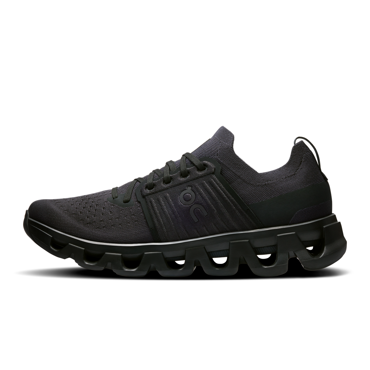 Men's black running shoes with lace-up knit upper and green accent overlays