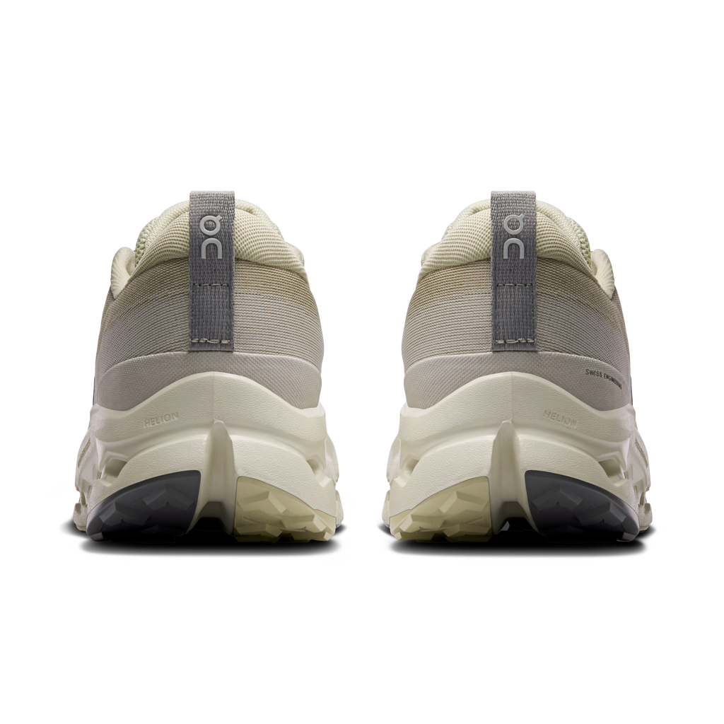 Men's trail running shoes, back view, light beige upper with heel pull tab