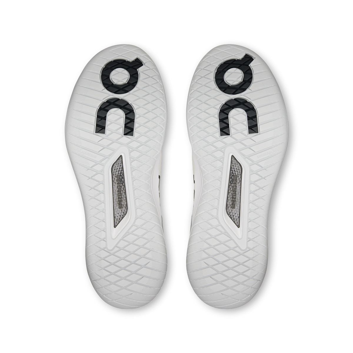 Pair of white sneaker outsoles with tread pattern and circular On branding