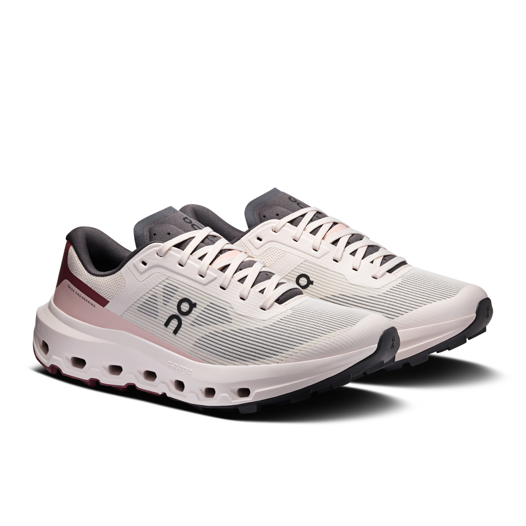 Women's running shoes, white knit upper with maroon accents and grey padded collar.
