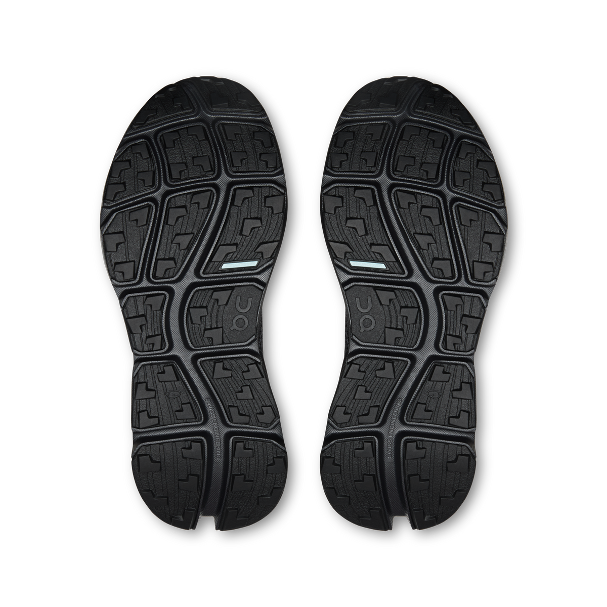 Pair of black outsoles with deep tread pattern and On logo detail
