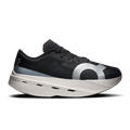 On men's running shoes, black mesh upper with lace-up front and white Cloud-style sole