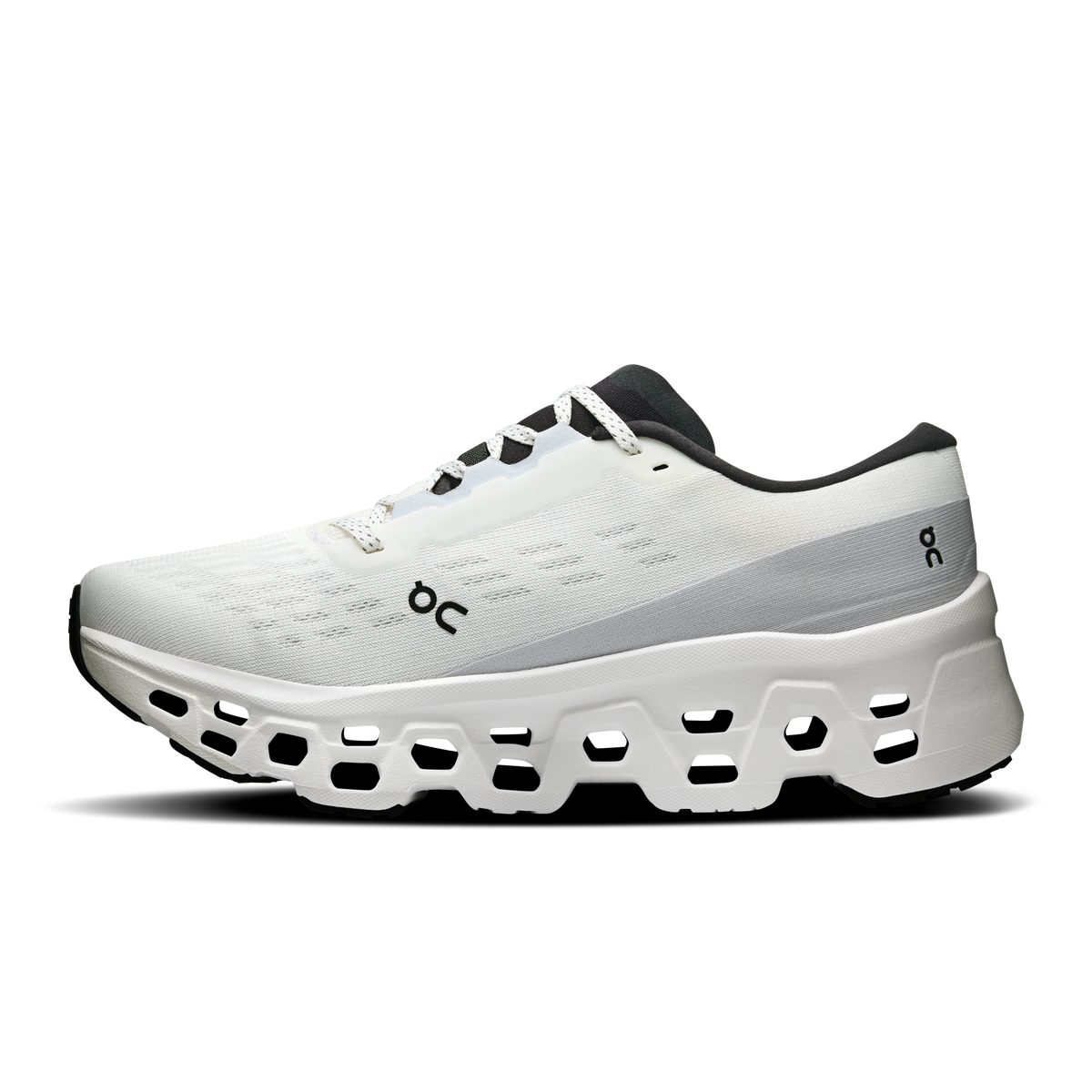 Women's white running shoes, side profile, lace-up with black ON logo accents