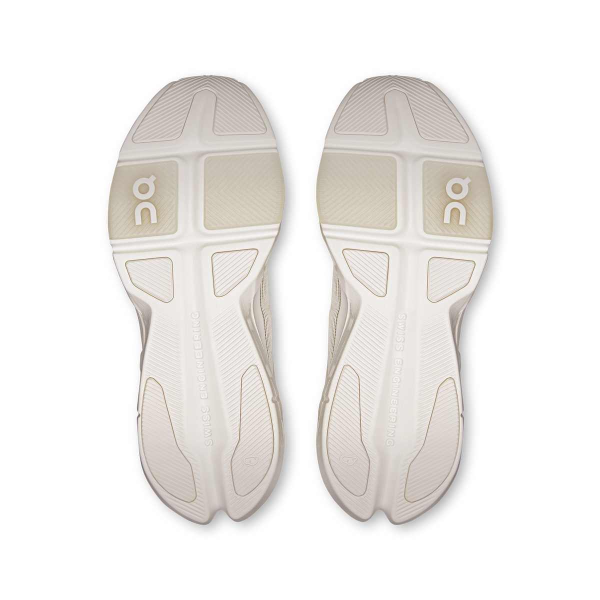 Pair of white outsoles with On logo and traction tread for running shoes