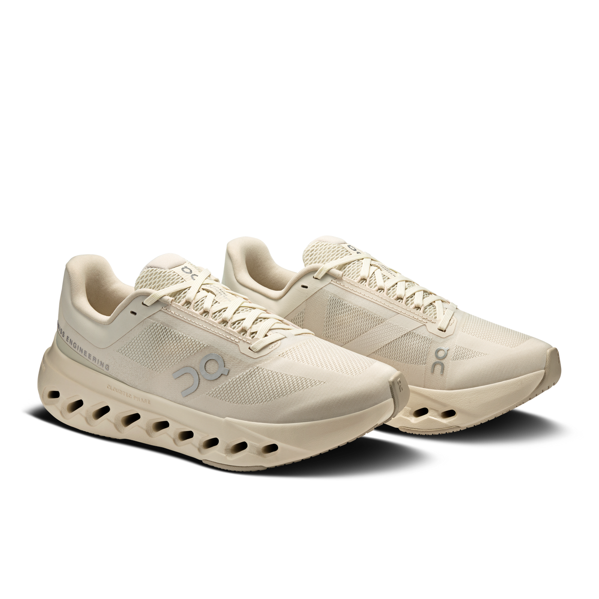 Pair of women's running shoes in light beige with lace-up mesh and cushioned outsole