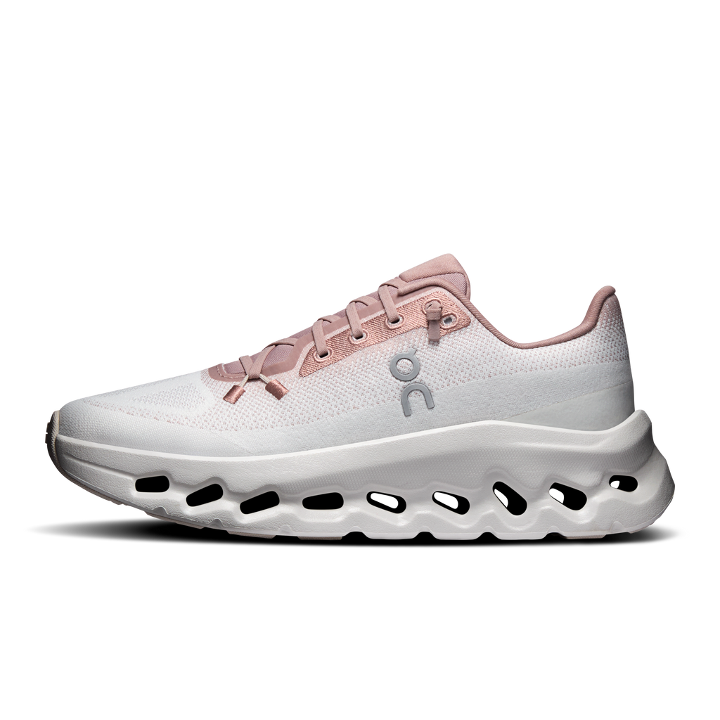 Women’s running shoe side profile in ivory with pink laces and cushioned sole