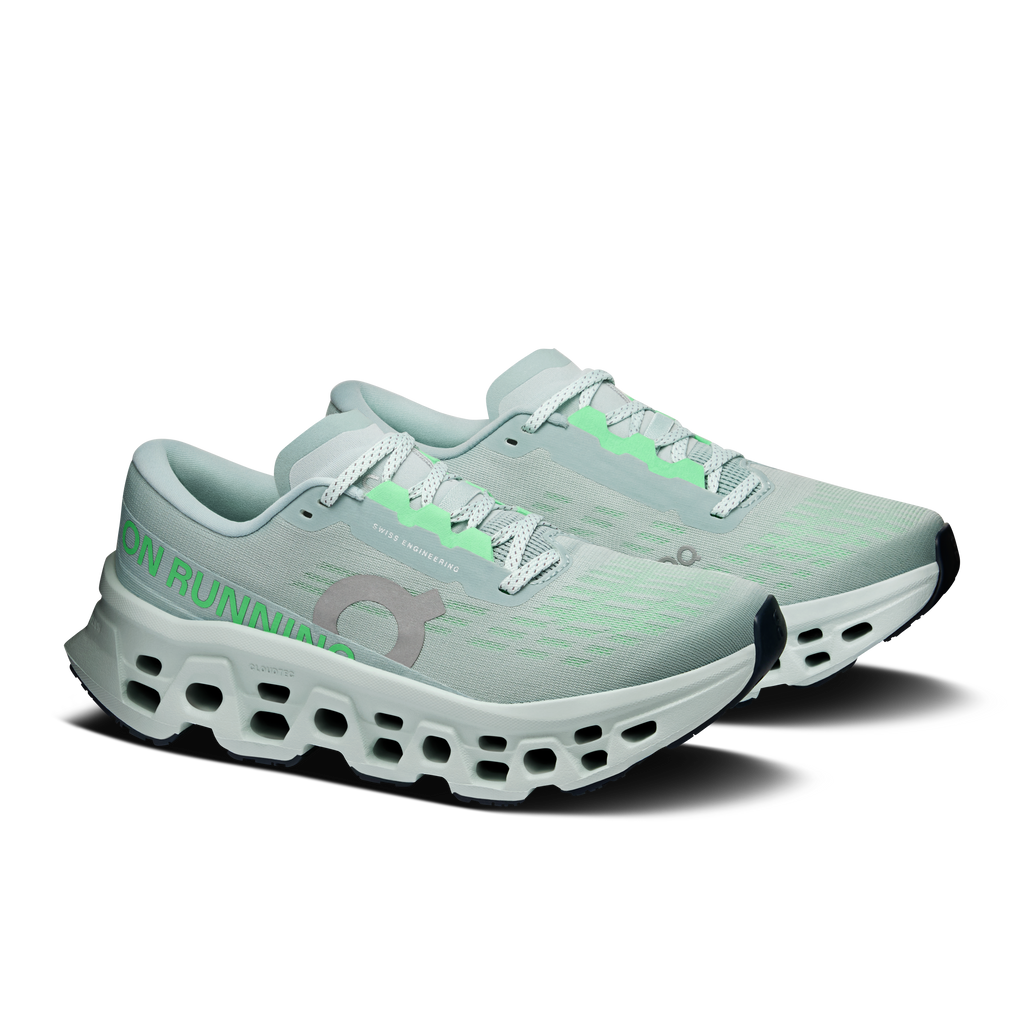 Women’s On running shoes, light gray-blue knit with mint laces and cushioned white sole.