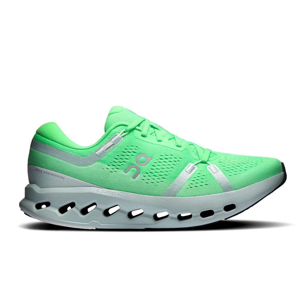 Men's green running shoes with silver side panels and black CloudTec sole pods