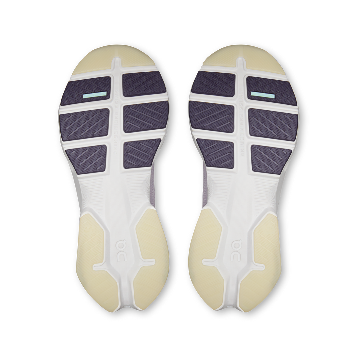 Pair of shoe outsoles with purple traction tread and white foam midsole