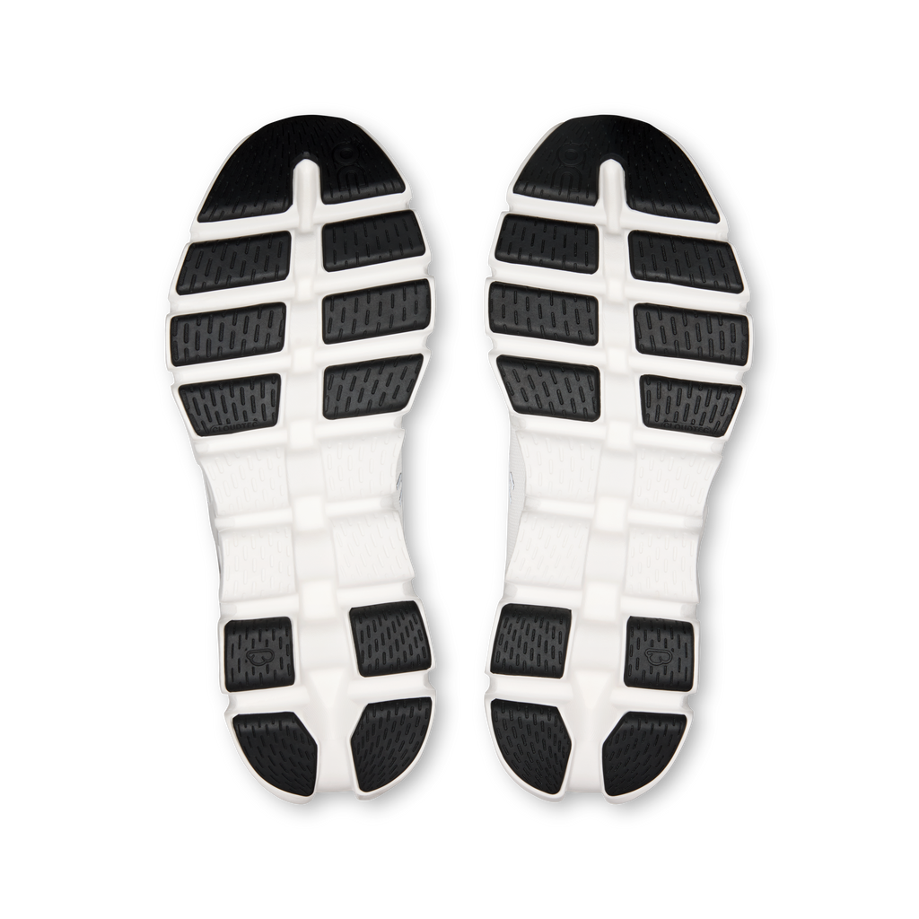 Shoe outsoles view: white rubber tread with black traction blocks