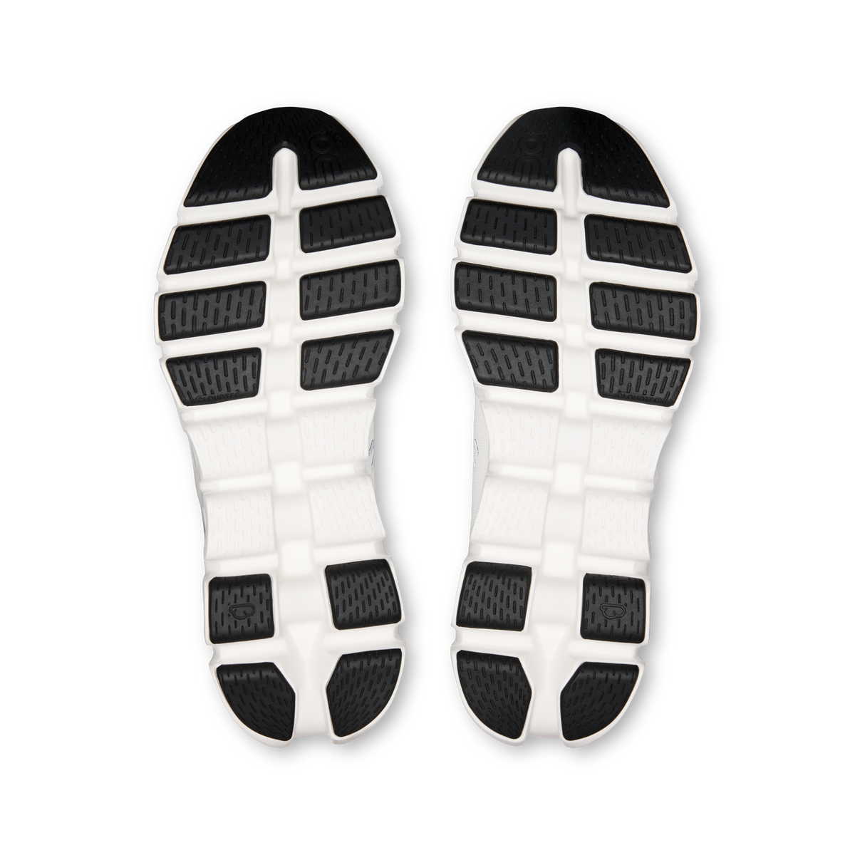 Shoe outsoles view: white rubber tread with black traction blocks