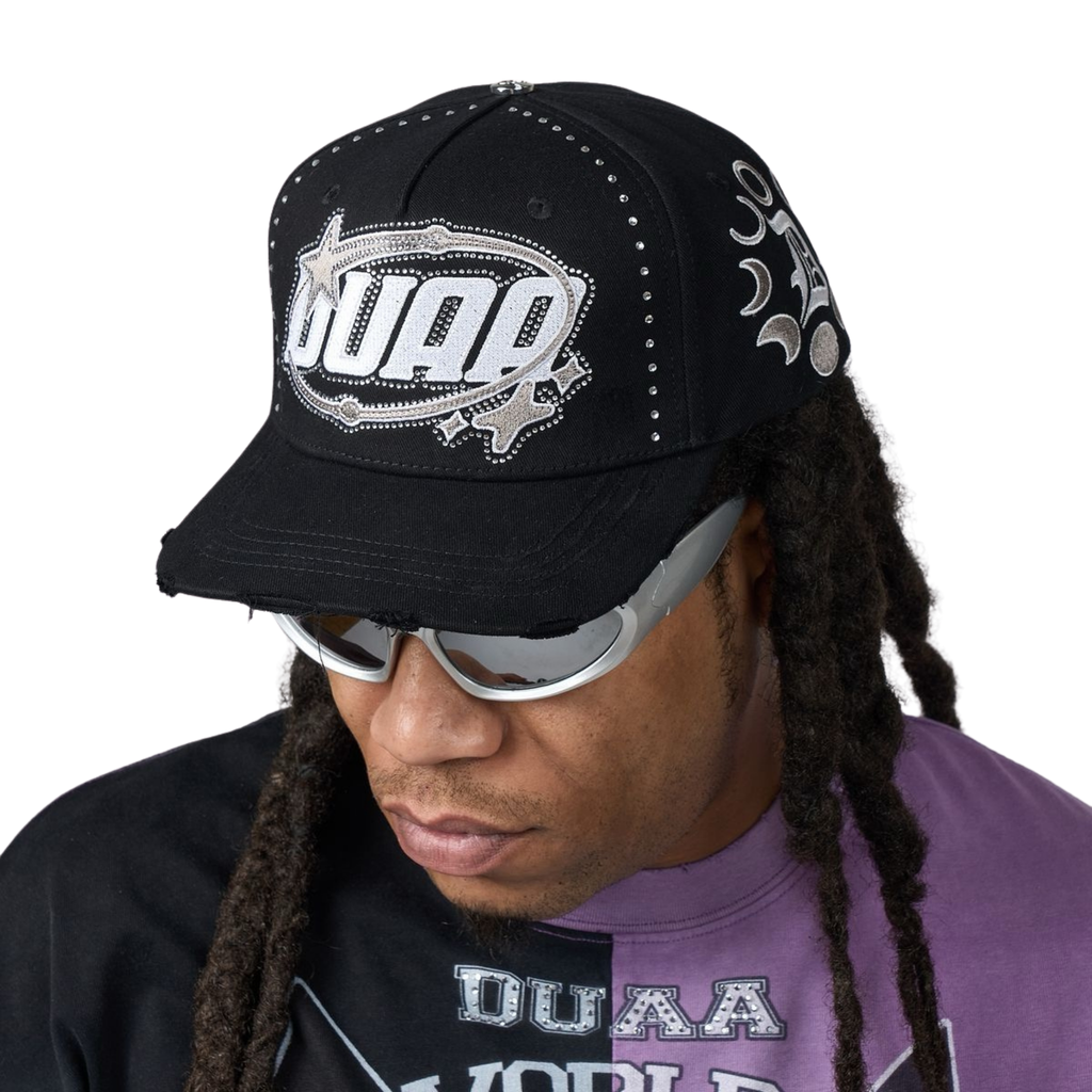 Men's black baseball cap with studded trim and DUAA front graphic