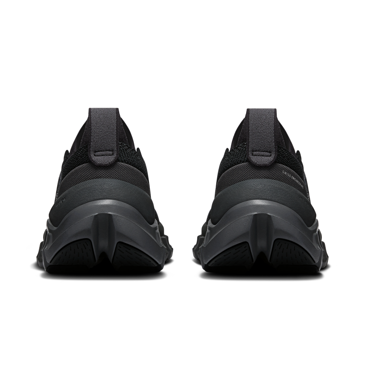 Black running shoes rear view with padded heel, thick midsole, and textured outsole