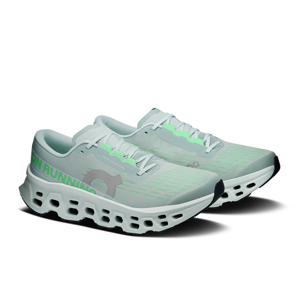 Pair of men's running shoes, light blue-green upper, green laces, CloudTec pods