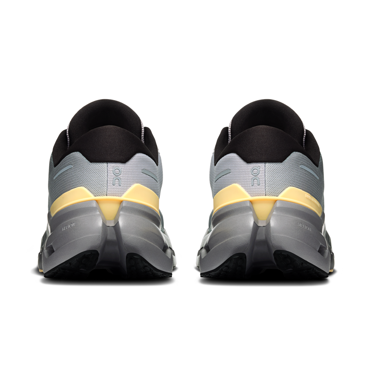 Men's running shoes heel view: dark collars, light gray uppers with gold/yellow accents