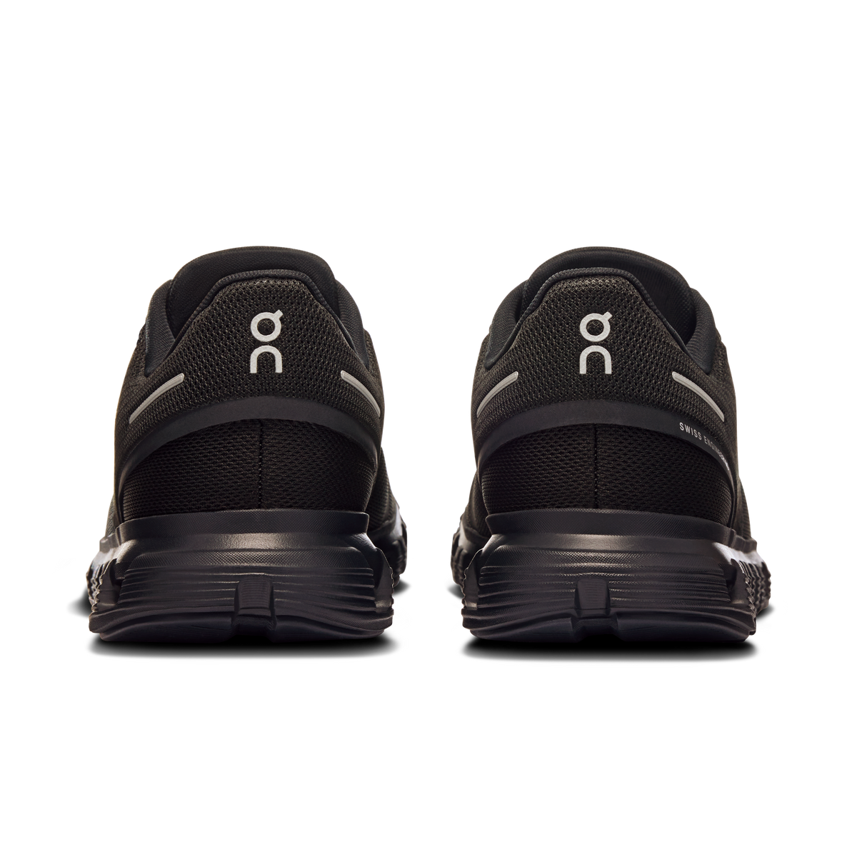 Women’s black running shoes from heel view with On logo and cushioned sole