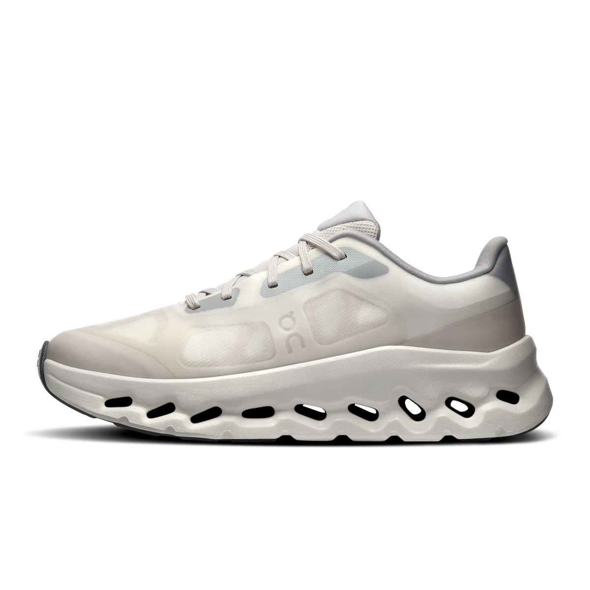 Women's ivory running shoe with lace-up, molded panels, and cushioned midsole