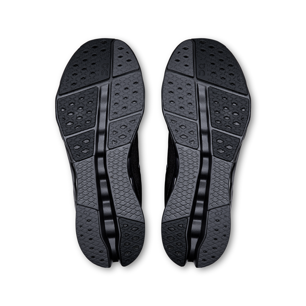 Men's black running shoes, pair showing textured rubber outsoles