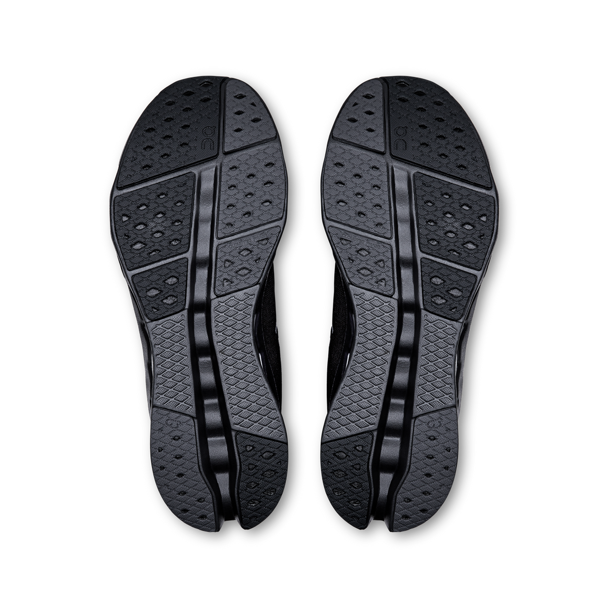 Men's black running shoes, pair showing textured rubber outsoles