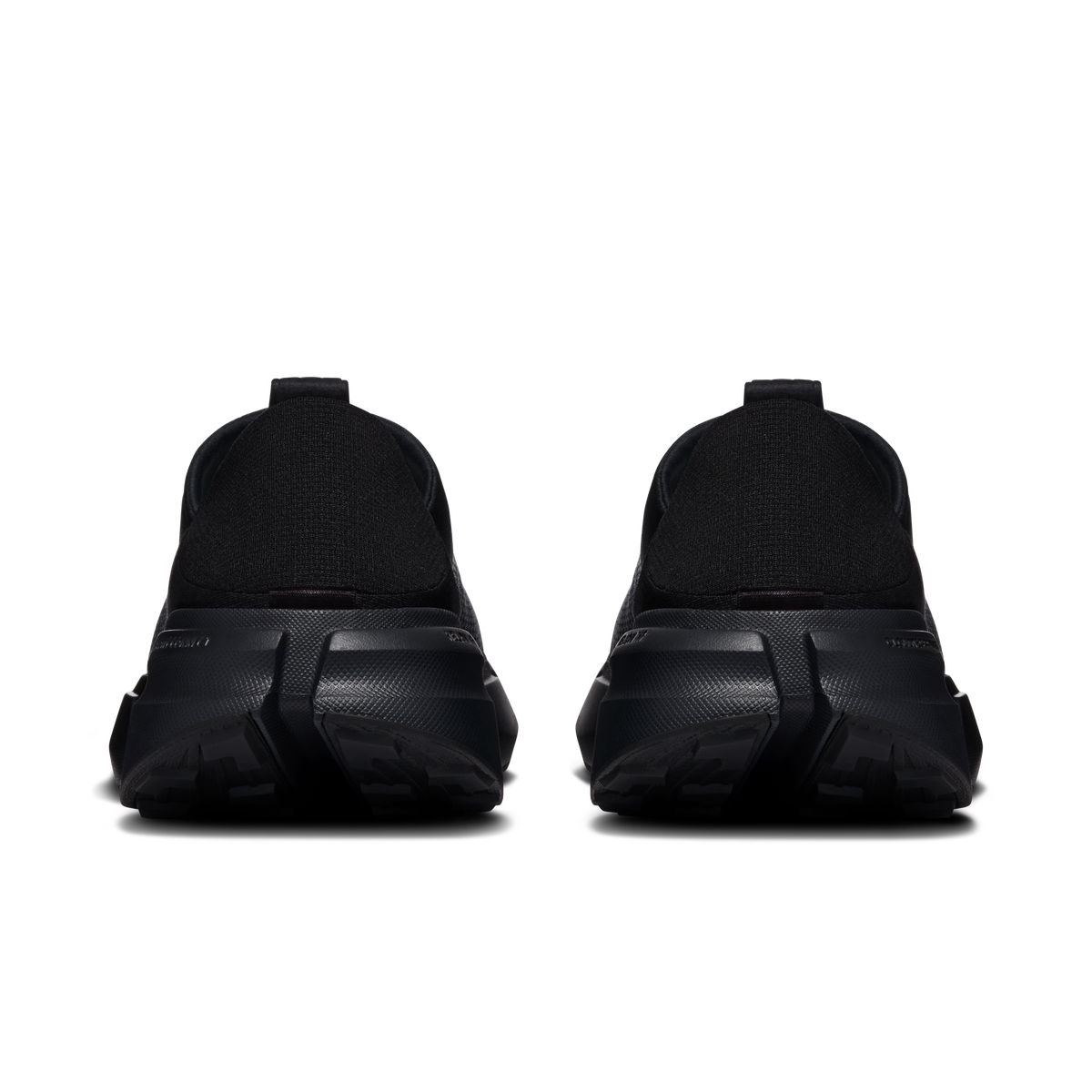 Women's black slip-on moc shoes, heel view with molded heel counter and outsole