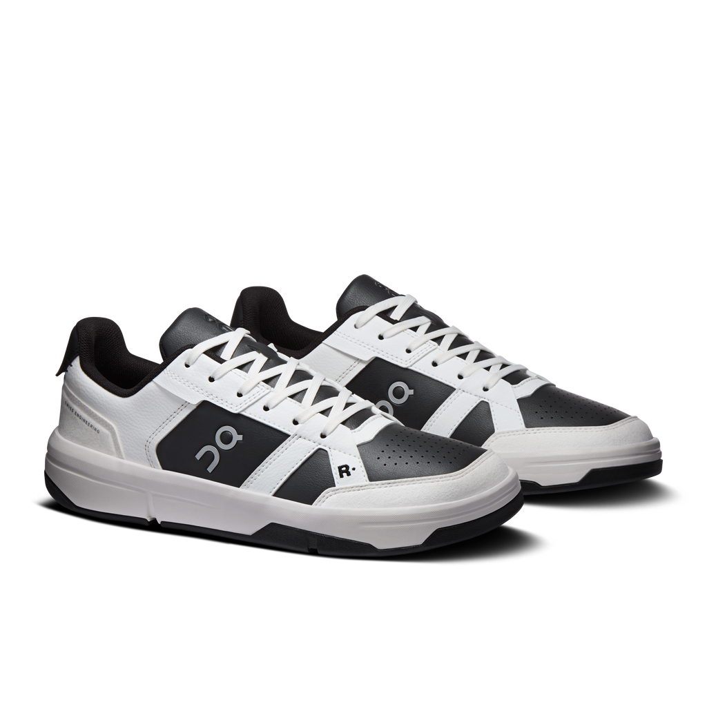 Pair of white and dark gray lace-up sneakers with On and R side accents