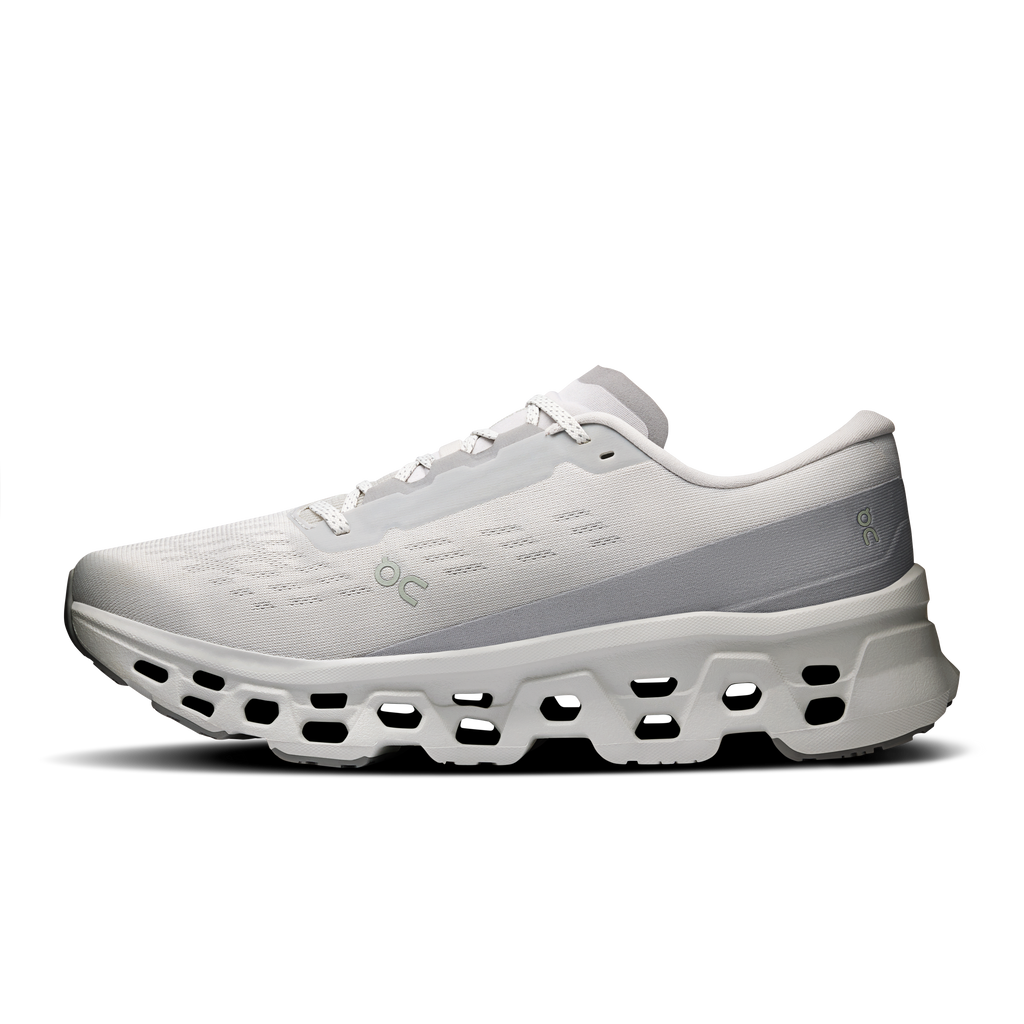 Men's light-gray lace-up running shoe with textured upper and chunky cutout sole