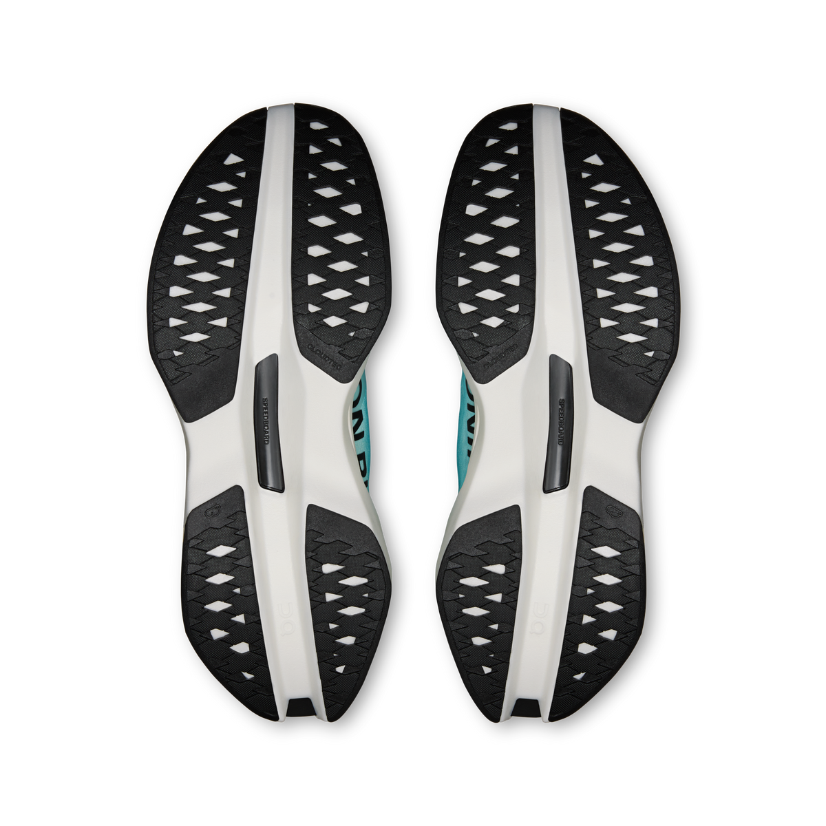 Pair of shoe outsoles with white midsole and black rubber traction pods